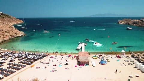 Aerial drone shot revealing Super Paradise Beach in Mykonos, Greece during Stock Footage 221252753