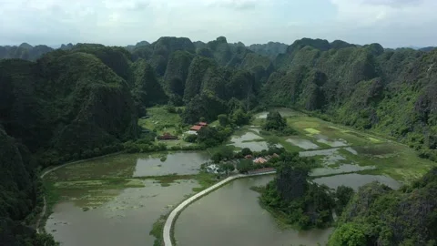 Aerial drone shot of rice fields between mountains in Ninh Binh National park Stock Footage 166545212