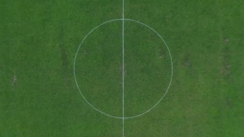 Aerial drone shot rising above football soccer field revealing whole pitch. Stock Footage