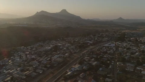 Aerial drone shot of rooftops and hills in Malawi, Africa Stock Footage 276111870