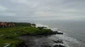 Aerial drone shot rough coastline waves at Bali Tanah Lot 4k or 4k+ Resolution