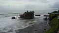 Aerial drone shot rough coastline waves at Bali Tanah Lot water temple 4k or 4k+ Resolution