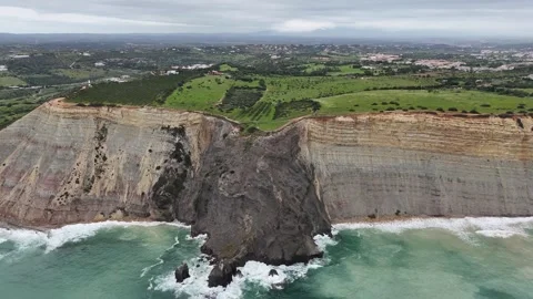 Aerial drone shot of rugged cliffs and coastline in Lagos, Portugal Stock Footage 338128151