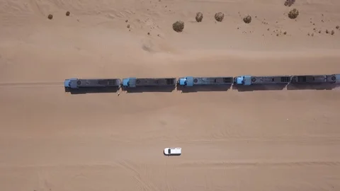 Aerial drone shot, running train alongside car, Namibia, Africa 4K establishing Stock Footage 91189860
