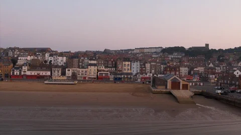 Aerial Drone shot of Scarborough Beach Town after Sunrise Stock Footage