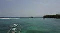 Aerial drone shot seascape follow ferry leaving Bali Padang Bai 4k or 4k+ Resolution