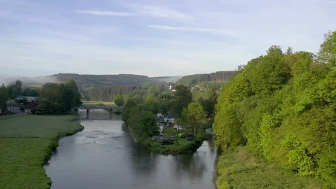 Aerial drone shot Semois river with a camping site, Belgium Ardennes Stock Footage 109114989