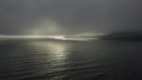 Aerial Drone Shot of Setting Sun over the Ocean Stock Footage 205310863
