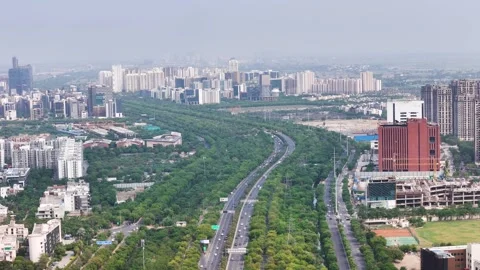 Aerial drone shot showcasing a clean, well-planned road network in Noida. Video stock 312487853