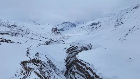 Aerial drone shot showcasing the dramatic landscape of Spiti, where deep Stock Footage 304943212