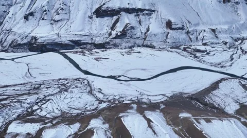 Aerial drone shot showcasing the endless stretch of snow-covered Himalayan Stock Footage 304957281