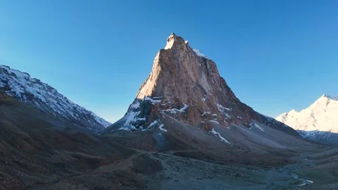 Aerial drone shot showcasing the first light illuminating the peaks of Gumbok Stock Footage 310751942