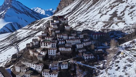 Aerial drone shot showcasing a panoramic view of Key Monastery as the sun dips Stock Footage 304953629