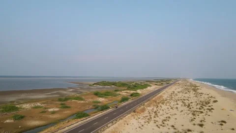 Aerial drone shot showcasing the pristine beauty of Dhanushkodi’s coastline and Stock Footage 297595274