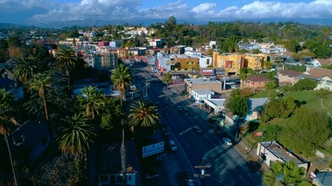 Aerial drone shot slowly rising up over Sunset Boulevard in Silver Lake Stock Footage