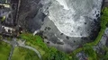 Aerial drone shot straight down coastline waves at Bali Tanah Lot water temple 4k or 4k+ Resolution