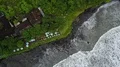 Aerial drone shot straight down coastline waves at Bali Tanah Lot water temple 4k or 4k+ Resolution