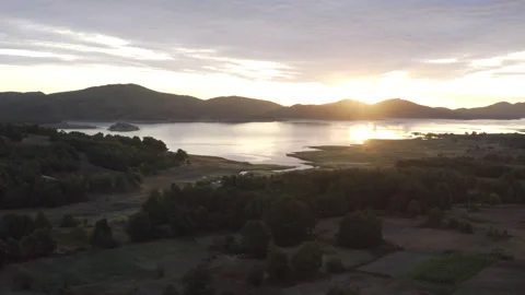 Aerial drone shot of stuning sunset over lake Plastira in Greece. 動画素材 147384691
