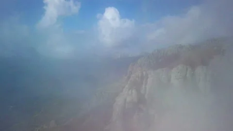 Aerial Drone Shot through clouds. Landscape from the height of bird flight Stock Footage 105354420