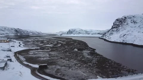 Aerial drone shot of tidal flat and river bank in the winter with snow 库存影片 145159965