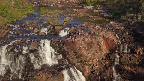Aerial Drone Shot Tilting Down on Massive Waterfall at Sunset, Chapada dos Video stock 301614594