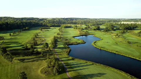 Aerial Drone Shot Tracking Over Golf Course on Niagara Escarpment at Sunrise Stock Footage 313909248