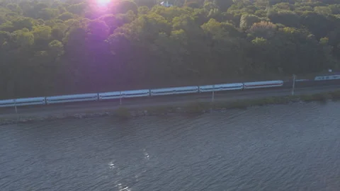 Aerial Drone Shot Tracking Train Approaching New York City Along Hudson River Video stock 143207686