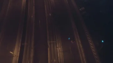 Aerial Drone Shot Of Traffic On A City Bridge on a foggy Night Stock Footage
