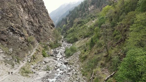 Aerial drone shot of two 2 hikers trekkers hiking trekking walking Stock Footage 156955459