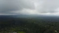 Aerial drone shot valley rice fields cloudy mountain forest landscape Indonesia 4k or 4k+ Resolution