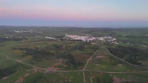 Aerial drone shot of Vila do Bispo village and coastal landscape in Portugal Stock Footage 338126309