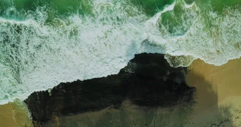 Aerial Drone Shot of Waves Breaking into Abstract Ocean Patterns Stock Footage 330584831