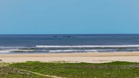 Aerial drone shot of waves rolling onto Chennai beach along Bay of Bengal Stock Footage 341509576
