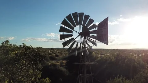 Aerial drone shot of Windmill Windpump turning pumping water Stock Footage 112533377