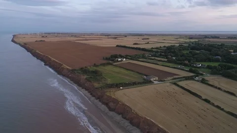 Aerial Drone Showing Fields and Farms at Sunset on the East Yorkshire Coastli Stock Footage 219486787