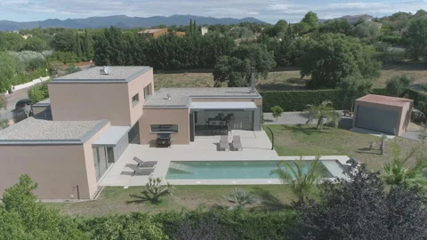 AERIAL DRONE SIDE VIEW OF CUBE HOUSE AND POOL FOR REAL ESTATE Stock Footage 170725276