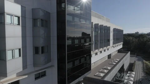 Aerial Drone side view of grey business building facade Stock Footage 130007897