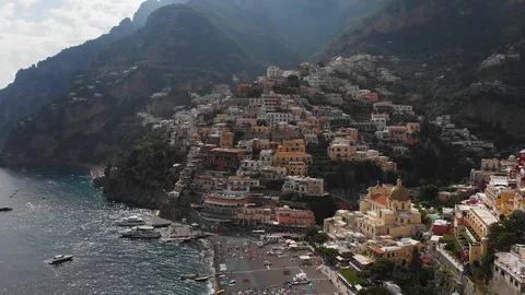 Aerial drone sideview pull back sea and city of Positano in Amalfi coast Stock Footage 113703069
