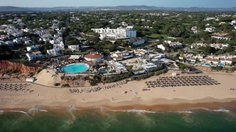 Aerial drone sideways panning of a beachside resort at Vale do Lobo, Algarve Stock Footage 244536225