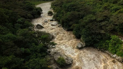 Aerial drone slow motion view of Urubamba River near Machu Picchu and Andes in Stock Footage 105890733