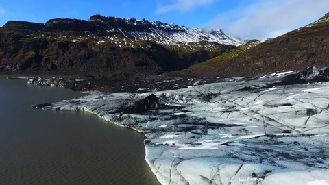 Aerial Drone Slow Pan Over Glacier & Lake In Iceland Stock Footage