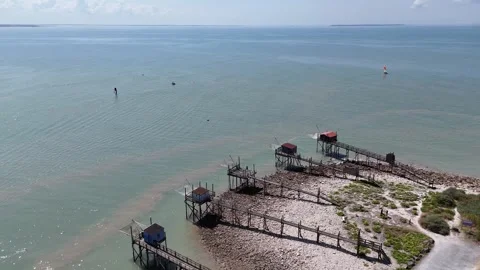 Aerial Drone Smooth circular movement showing traditional fishing huts on stilts Video stock 316063199