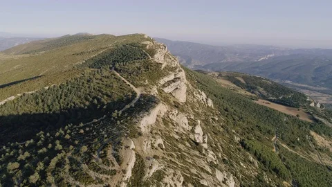 Aerial Drone smooth forward in mountain range rocky track valley with horizon Stock Footage 129942007