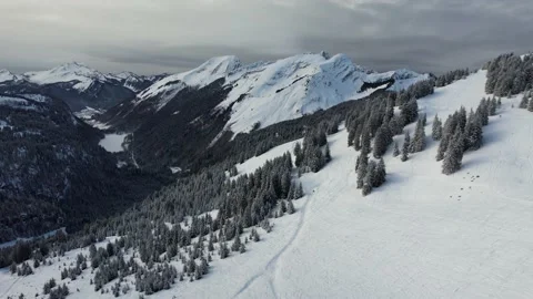 Aerial drone snow mountains range dark sky Stock Footage 168989743