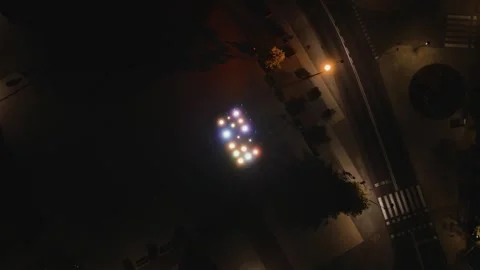 Aerial Drone Spiral Up Flight Over Illuminated Fountain at Night Stock Footage 323769833