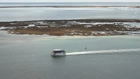 Aerial drone static view of a ferry boat on the Ria Formosa, Algarve region Stock Footage 236374239