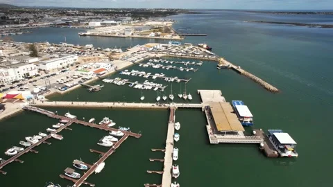 Aerial drone static view of tourists at a jetty pier leaving from a ferry boat Stock Footage 236373960
