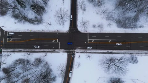 Aerial Drone Static View Winter Traffic Snow Plow at Intersection 4K Video stock 329316447