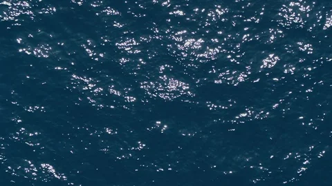 Aerial drone sun reflections flickering of the sea blue water Video stock 109490887