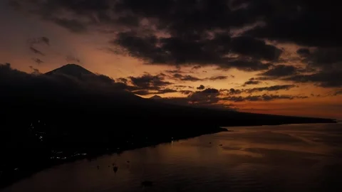 Aerial Drone Sunset Over Amed Bay With Mount Agung and Batur Silhouette Bali Stock-Footage 331786831